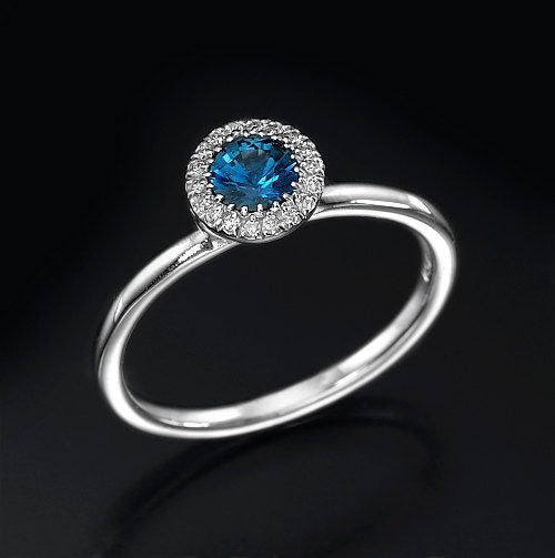 Blue sapphire halo diamond ring