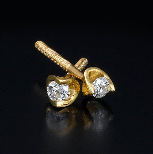 Gold stud earrings